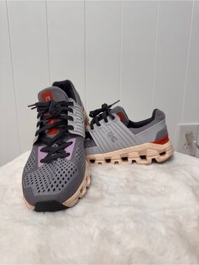 On Running Gray Sneakers with Pink and Orange Accents